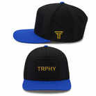 TRPHY five panel patch hat in black with a royal blue bill, front and side views