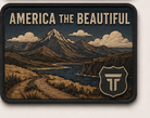 America The Beautiful patch, mountain range and river valley with a road